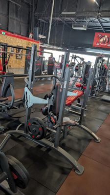 a gym with a lot of equipment in the room