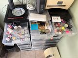 a lot of crafting supplies on the counter