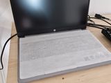 a laptop that is sitting on a desk with a mouse
