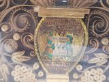 a picture of a gold vase with a crown on it