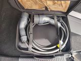 a suitcase with a hose in it on the floor