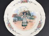 a plate with a picture of a woman on it