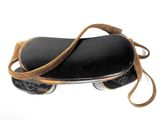 a black skateboard with a brown strap on it
