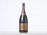 a bottle of champagne sitting on top of a white table