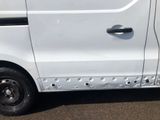 a white van with holes on the side of it