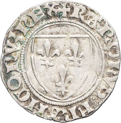 a close up of a silver coin with a coat of arms on it