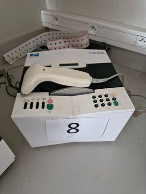 a wii controller sitting on top of a box