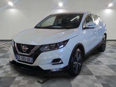 a white nissan qx sport suv parked in a garage