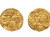 two gold coins, one of which has a design on the front and the other of which has a design on the back