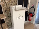 a picture of a bathroom with a sink and a fire extinguisor