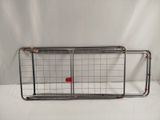 a metal rack that has a red ball in it