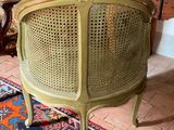 a chair that is sitting on a rug in a room