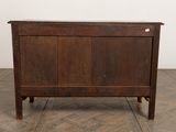 an image of a wooden chest on a parquet floor
