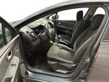 the interior of a car with the door open and the driver ' s seat down