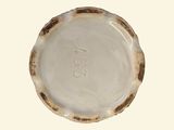 a white plate with a brown stripe on it