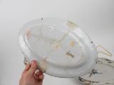 a person holding a plate that has been left on the table