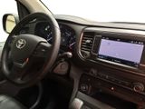 the interior of a car with a steering wheel and dashboard controls