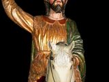 a statue of a man riding a horse with a bird in his hand