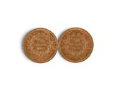 deux pennies, dont l'un représente un visage et l'autre une tête