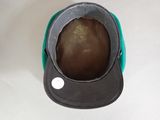 a black and green hat on a white table