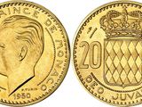 a close up of a gold coin with a crown on it