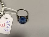a ring with a blue stone on it and a price tag