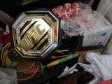 a box of tennis rackets and other items on the table