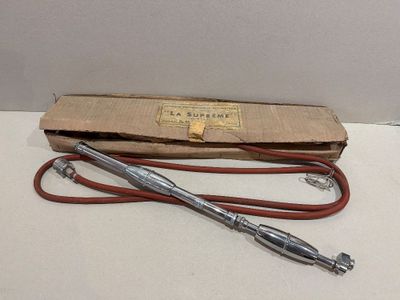 an old pair of scissors sitting on top of a cardboard box