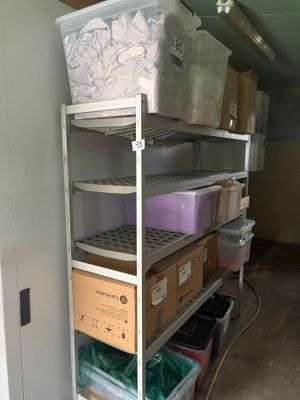 many boxes and boxes on the shelves in the room