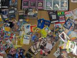 a lot of pokemon cards and other items on the table