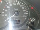 a close up of a car dashboard with a speedometer