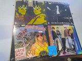 a lot of records on a table with a blue sticker on it