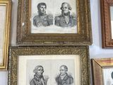many framed pictures of men and women on the wall