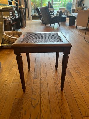 hardwood flooring in a living room with a table and chairs