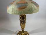 a lamp that is sitting on a table with a light on it