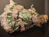 a doll that is laying down on a table