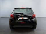 the back of a black car in a white room with a black floor