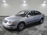 a picture of a silver car parked in a garage