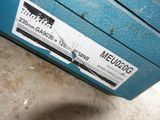 a close up of a blue machine with a sticker on it ' s side