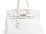 a white leather handbag on a white background