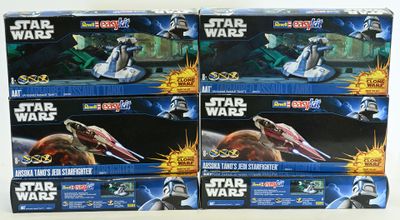 six star wars action figures sit in a row on a table