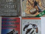 three books on a table with a gun and a gun on top of it