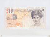 a picture of a british ten pound note in a glass case