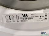a close up of a washing machine with a tag on it