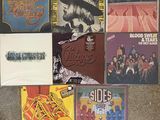 various album covers of various albums and albums on the floor