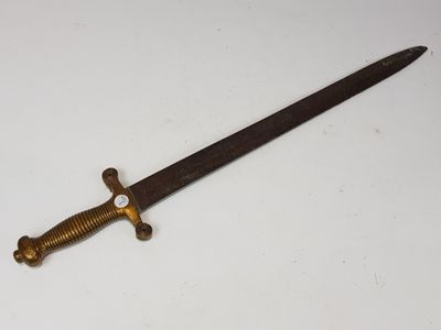 a close up of a knife on a table with a white background