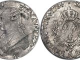 a close up of two silver coins on a white background