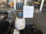 an image of a dirty gas can on a gas stove