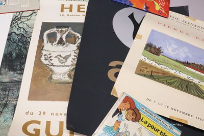 a lot of books that are laying on top of each other