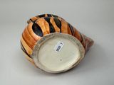 a small ceramic bowl with a tiger pattern on it